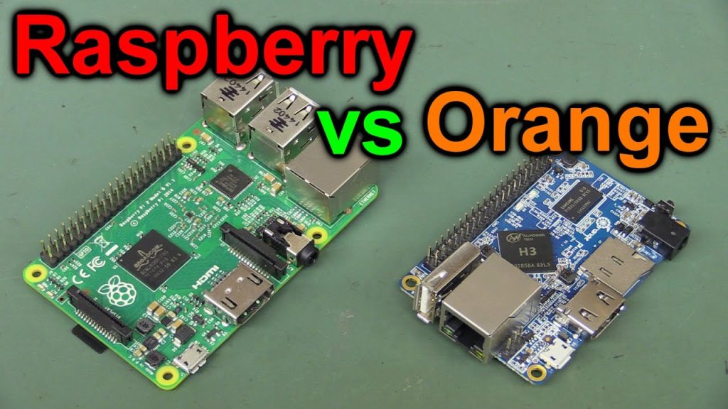 Orange Pi and Raspberry Pi single board computers side by side on a table